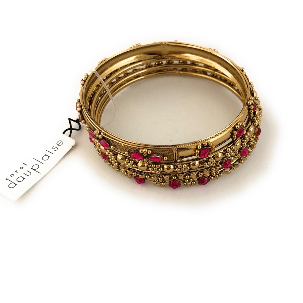 Set of four intricate, new Carol Daupaise bangles